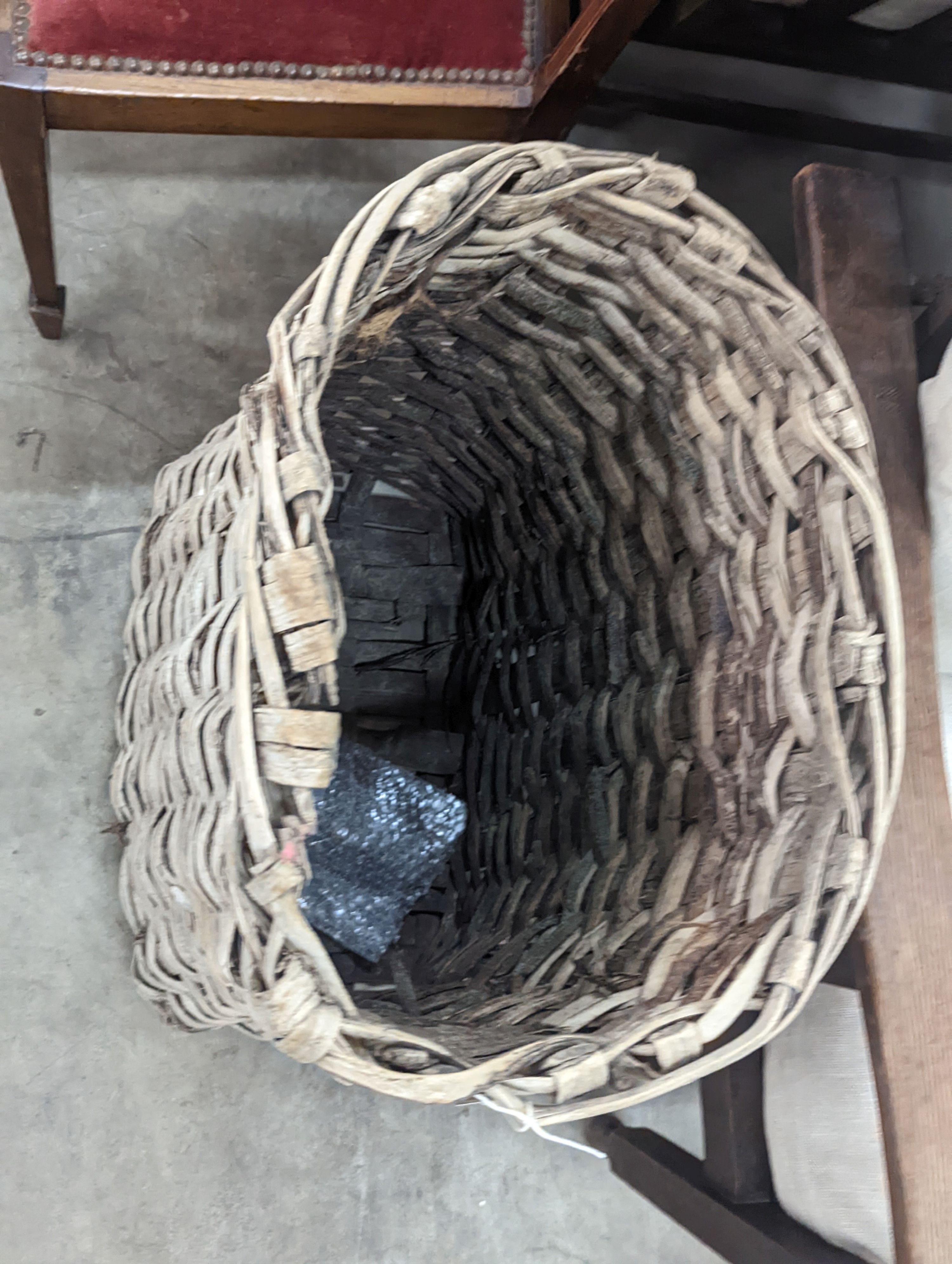 A vintage woven grape hod, width 48cm, height 64cm